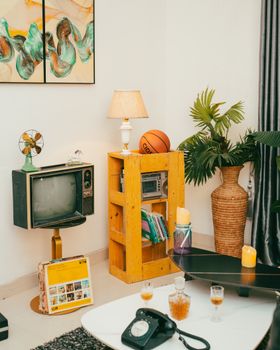 Charming retro living room with vintage decor and cozy lighting.