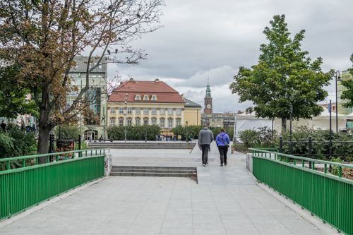 Free Explore the charming streets of Wrocław, featuring historic buildings and a peaceful pedestrian walkway. Stock Photo