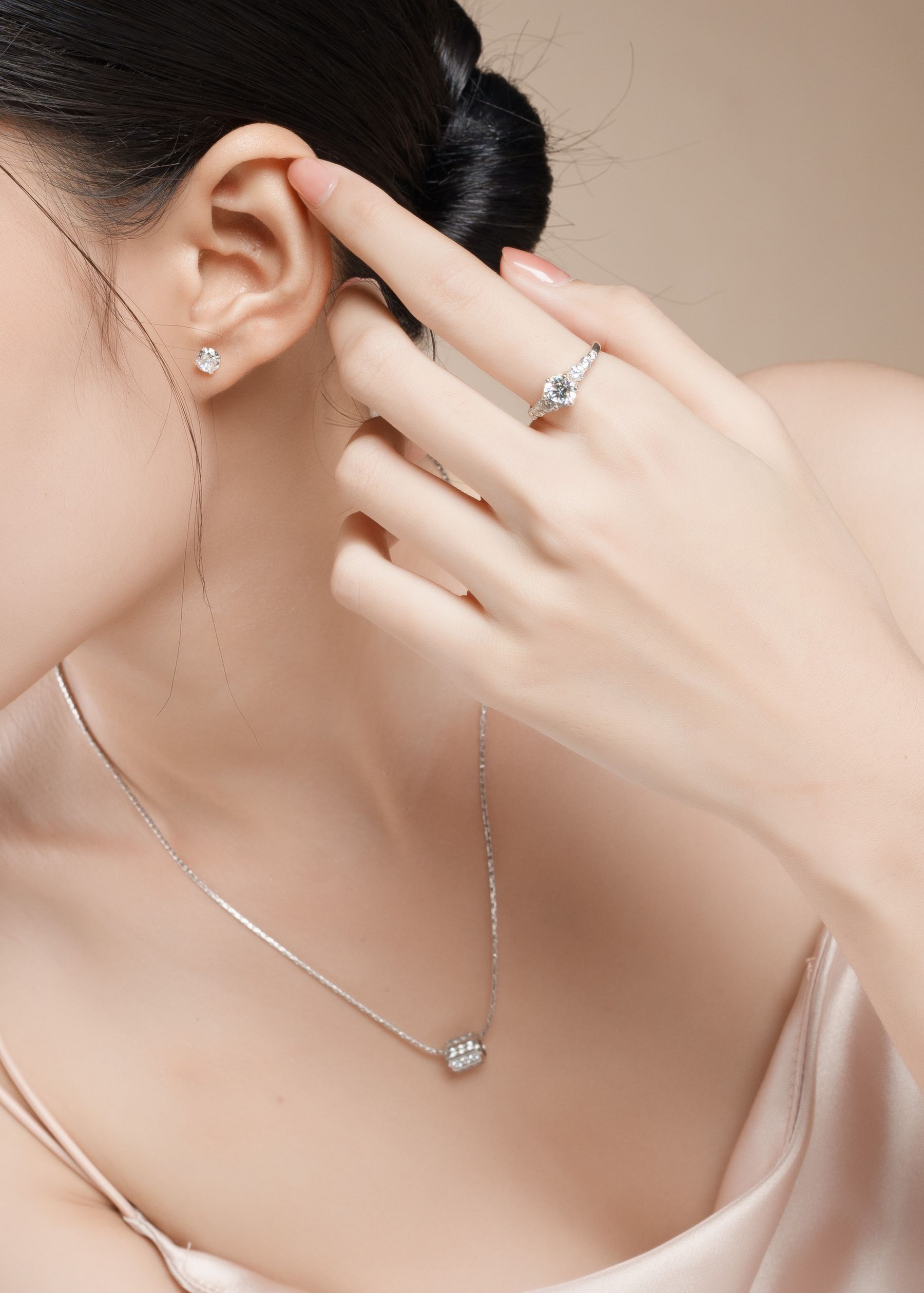 Close view of a necklace and ring