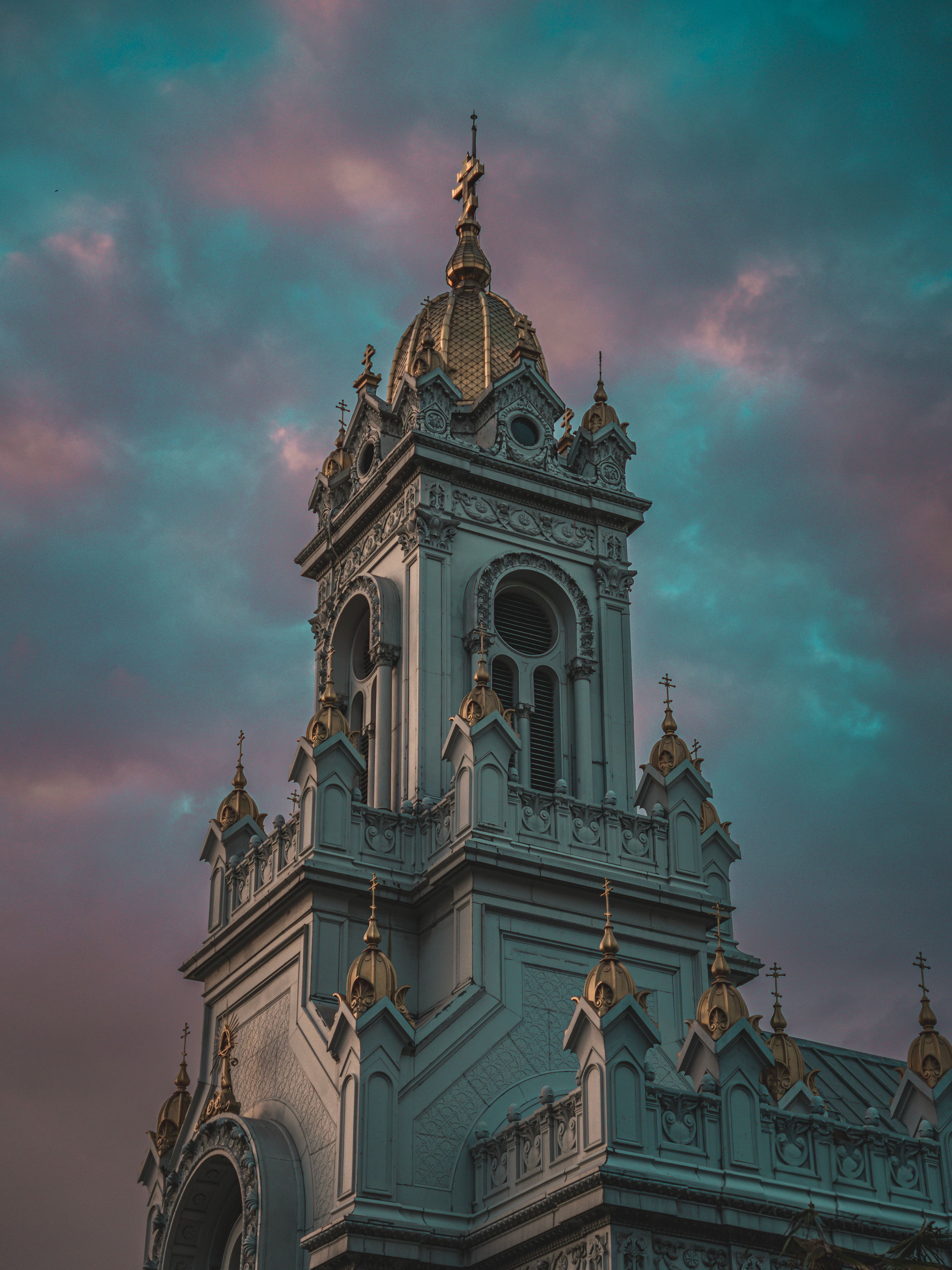 Ornate Church Tower Against Dramatic Sky · Free Stock Photo