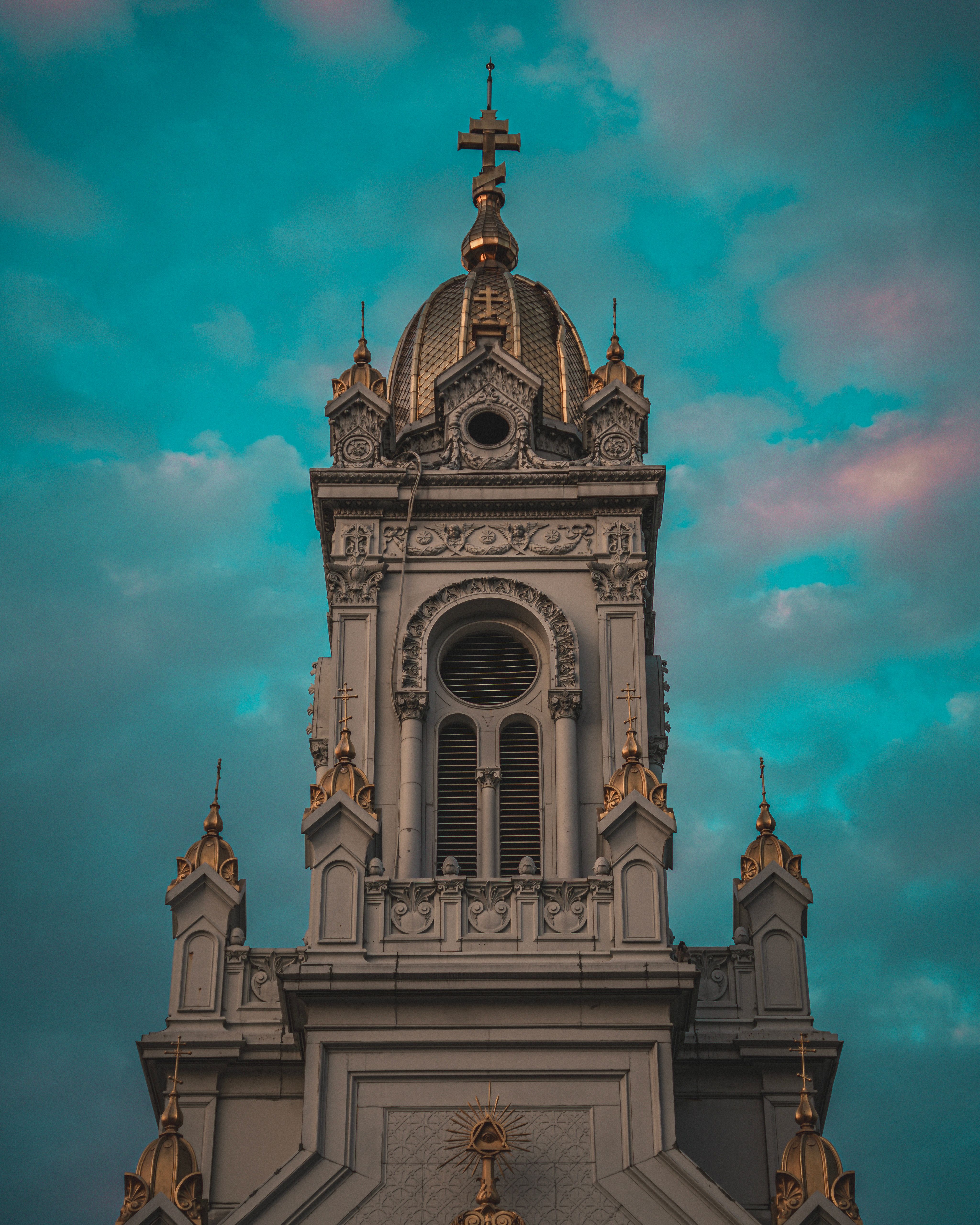 Ornate Church Tower Against Dramatic Sky · Free Stock Photo