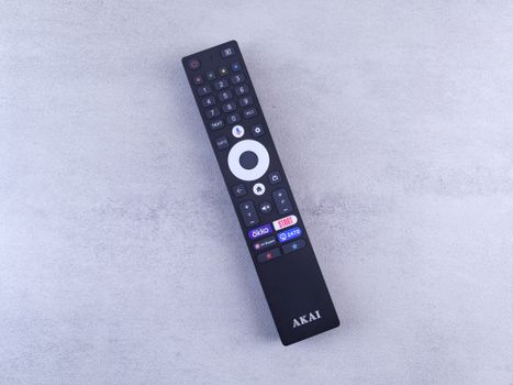 Modern Black Remote Control on Textured Surface