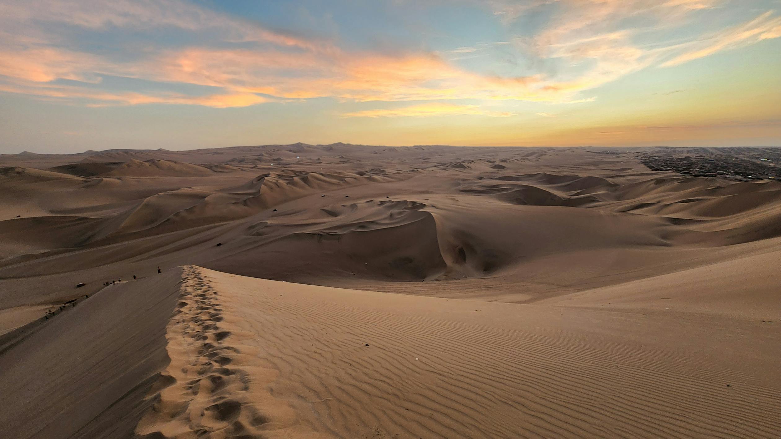 Scenic Sand Dunes at Sunset in Huacachina