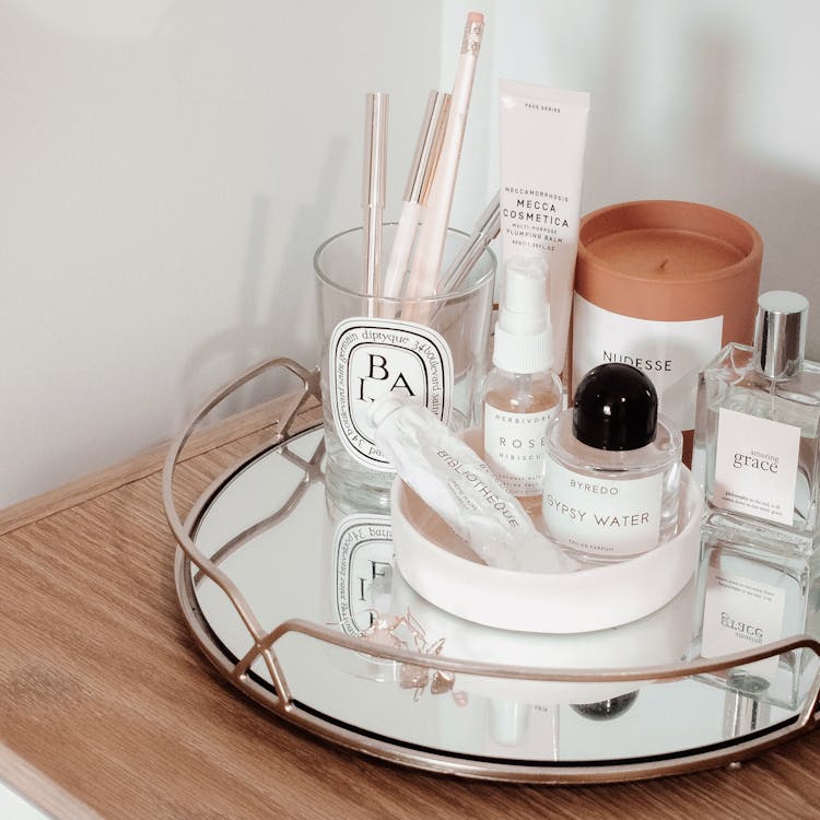 Free Makeup Set With Tray Beside Wall Stock Photo