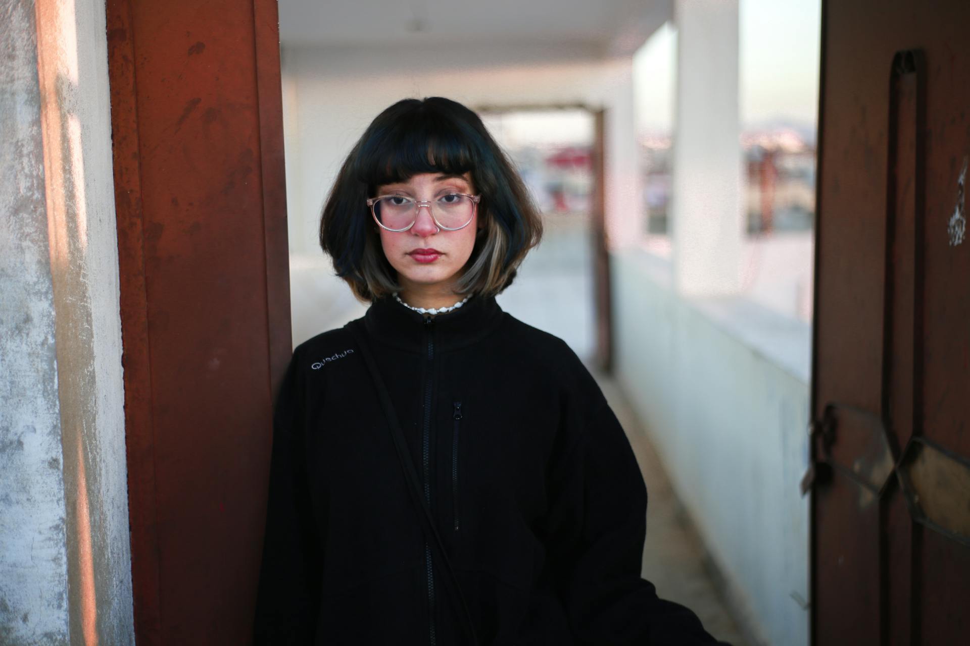 Young Woman with Bob Haircut and Glasses Outdoors