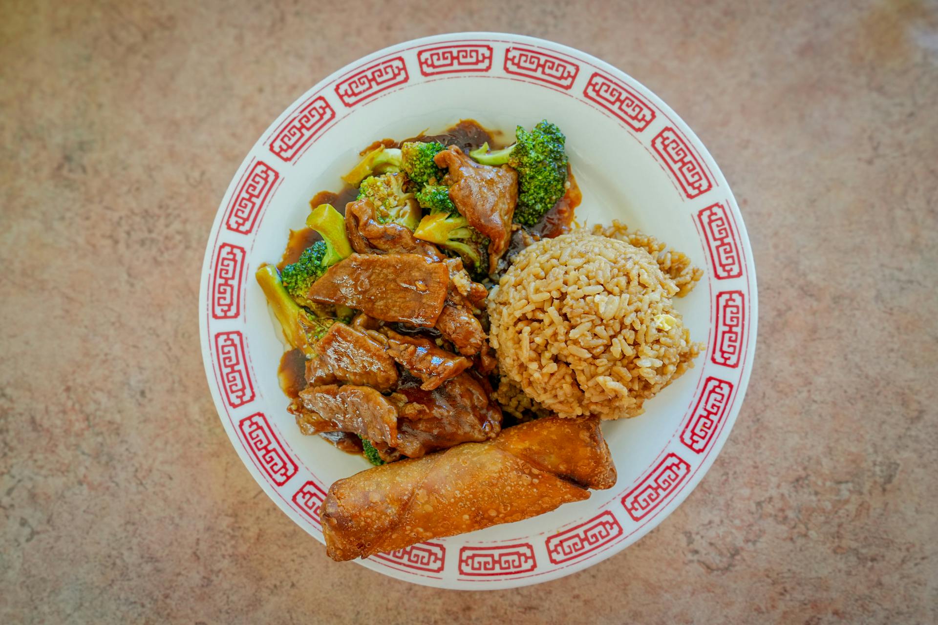 Plate of Beef and Broccoli with Fried Rice and Egg Roll