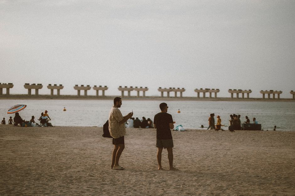 Tourists enjoying Jumeirah Beach on a mild winter day in Dubai