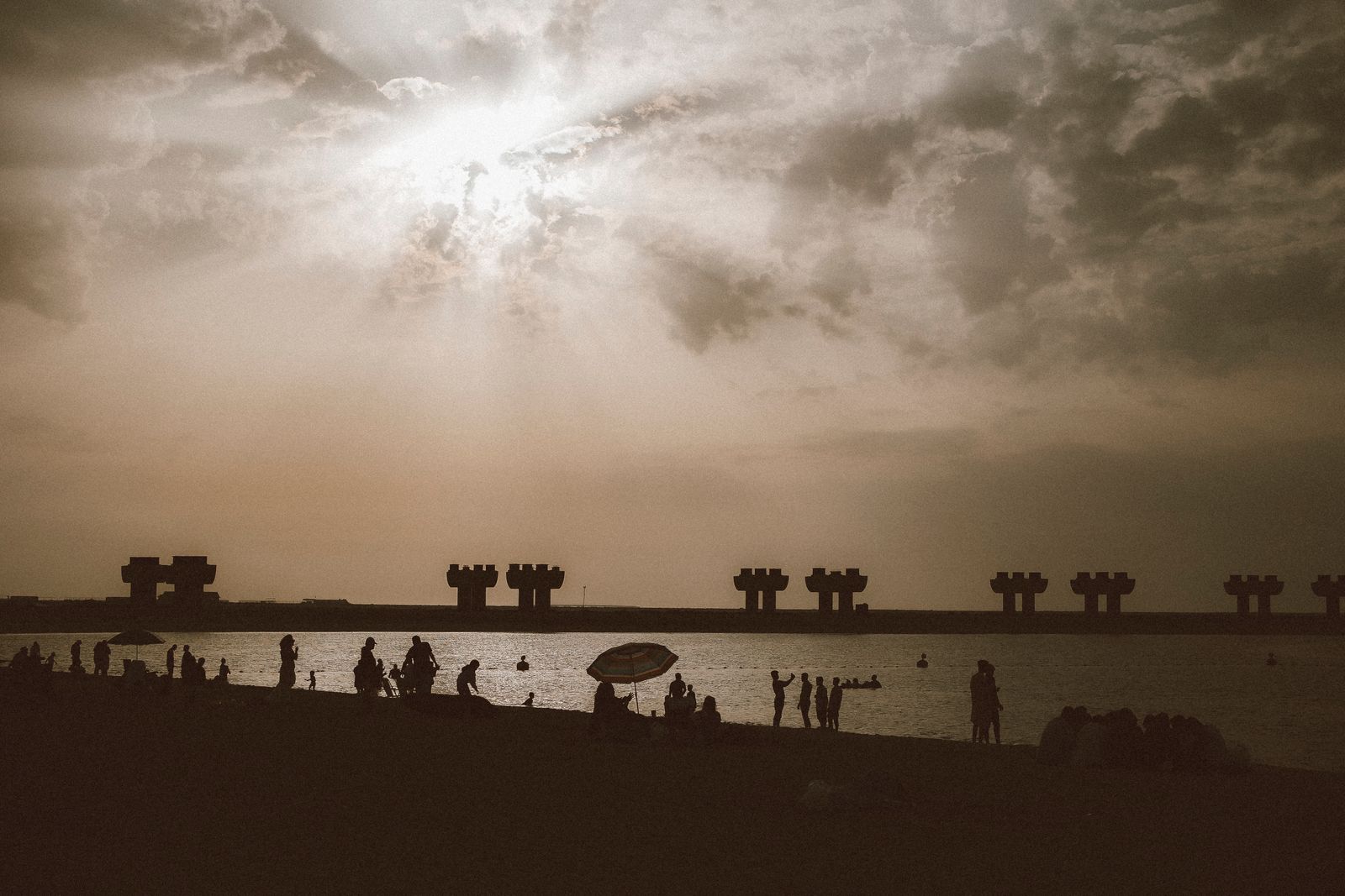 A candlelit VAANYA sound healing circle on the beach