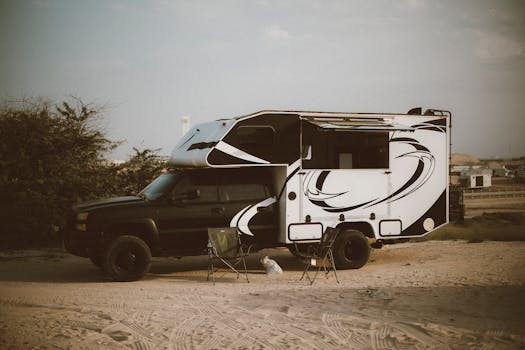 RV parked in Dubai desert, ideal for adventure camping and outdoor travel.