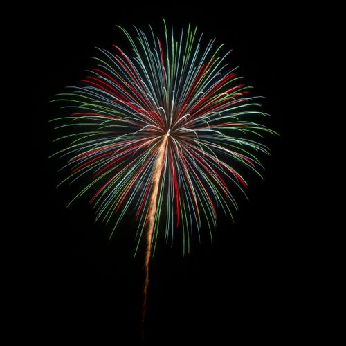 Free Colorful fireworks illuminate the night sky over Fukuoka, Japan, capturing a festive celebration. Stock Photo