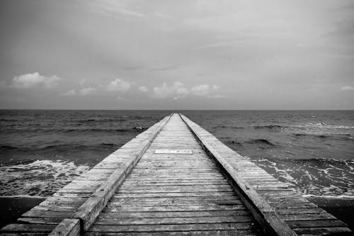 Free stock photo of dark clouds, landing stage, sea