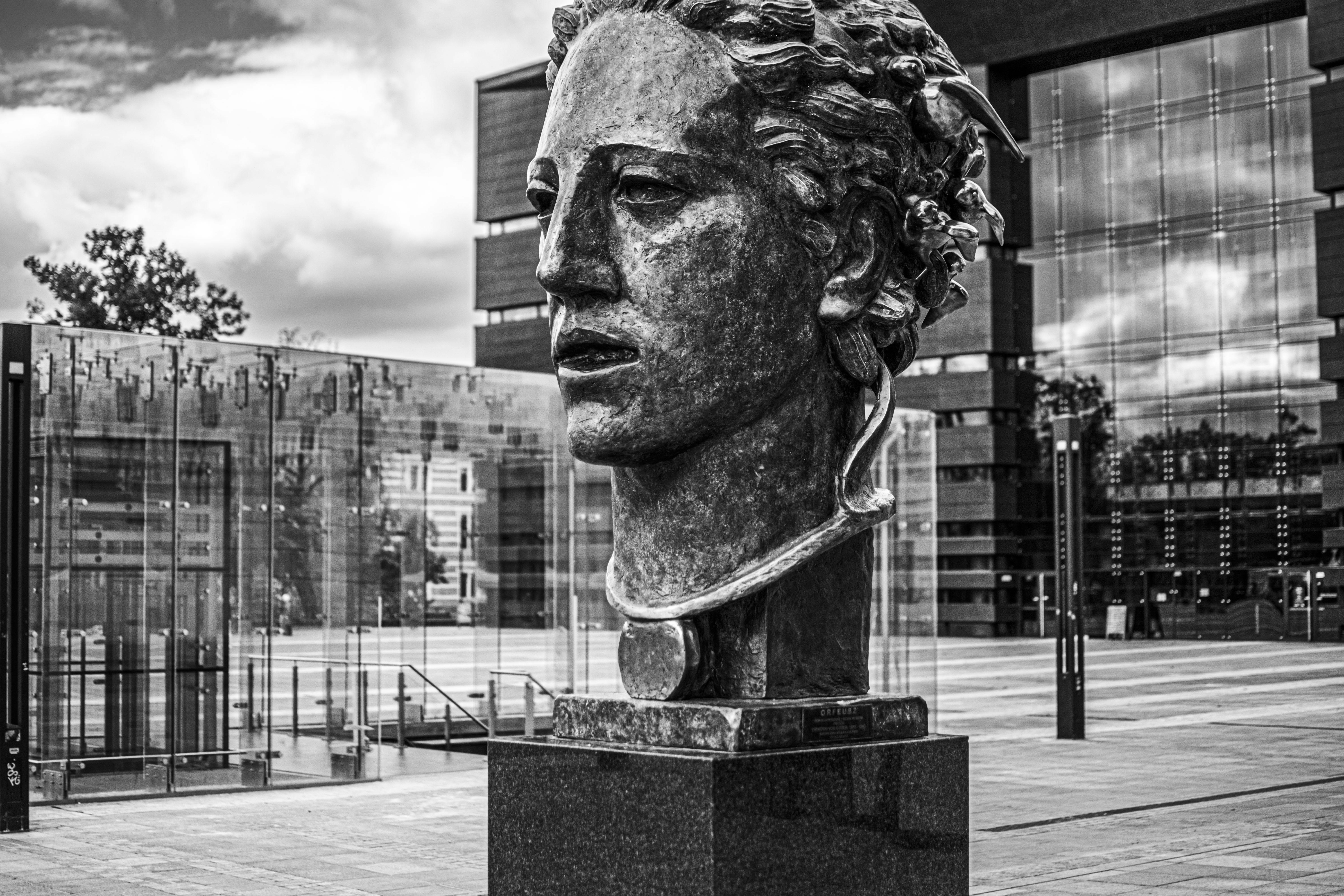 Black and white photo of Orpheus sculpture in Wrocław, Poland.
