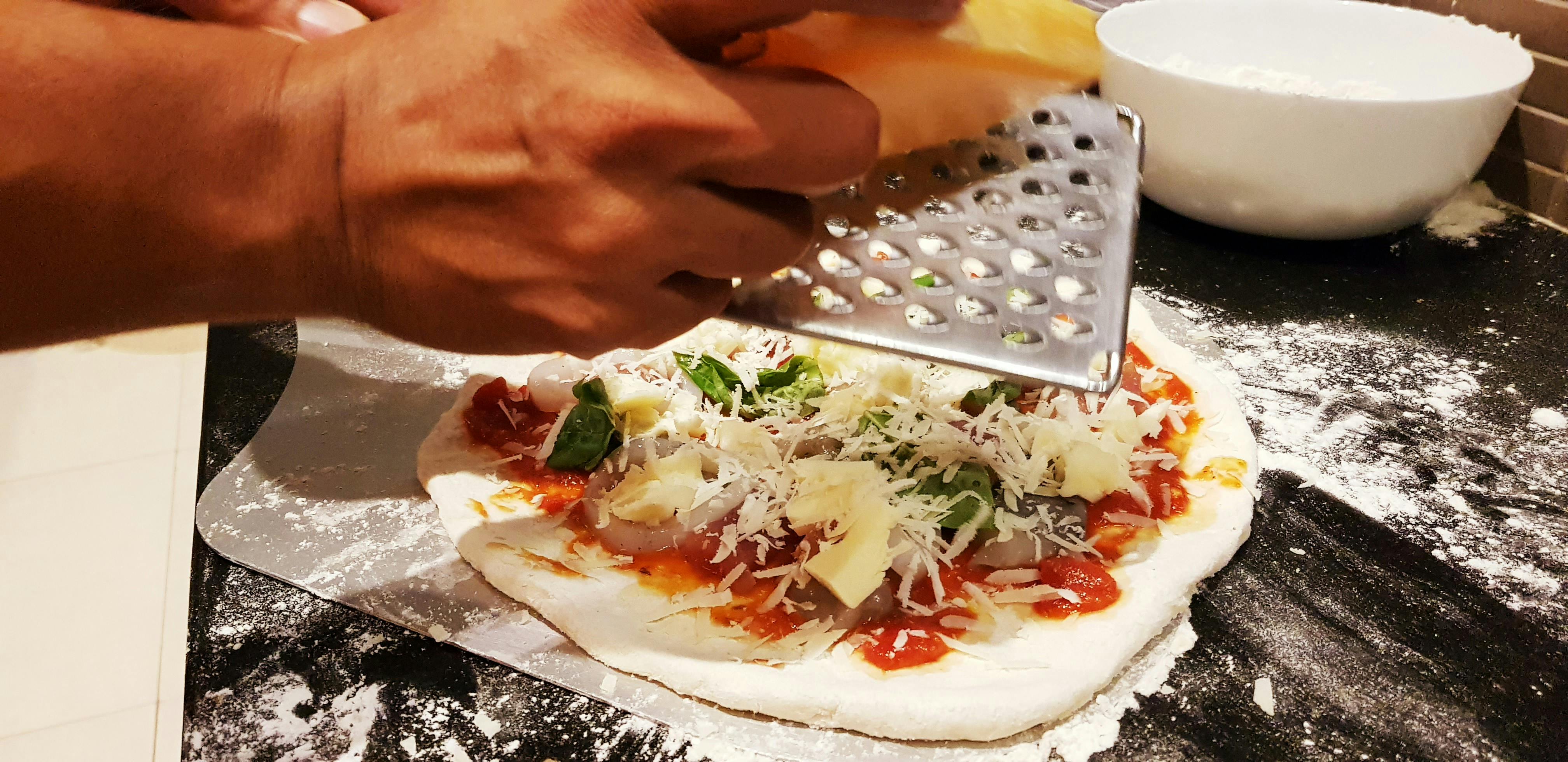 Scientist in laboratory holding a thin film solar cell sample with gloves