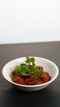 Delicious Indian Manchurian dish garnished with fresh cilantro, perfect for food enthusiasts.
