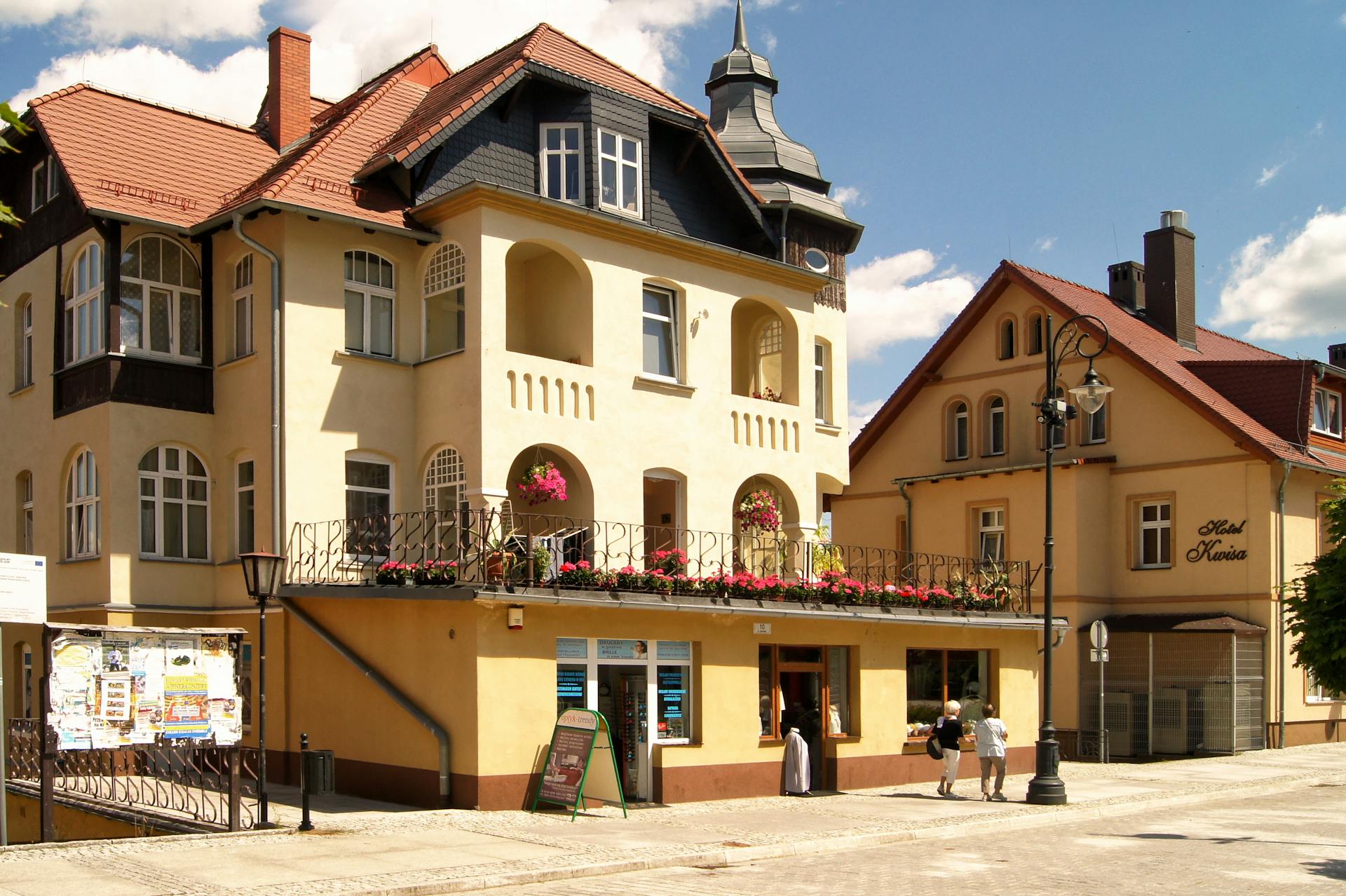 Historic architecture with floral accents in Świeradów-Zdrój. Perfect for travel enthusiasts.