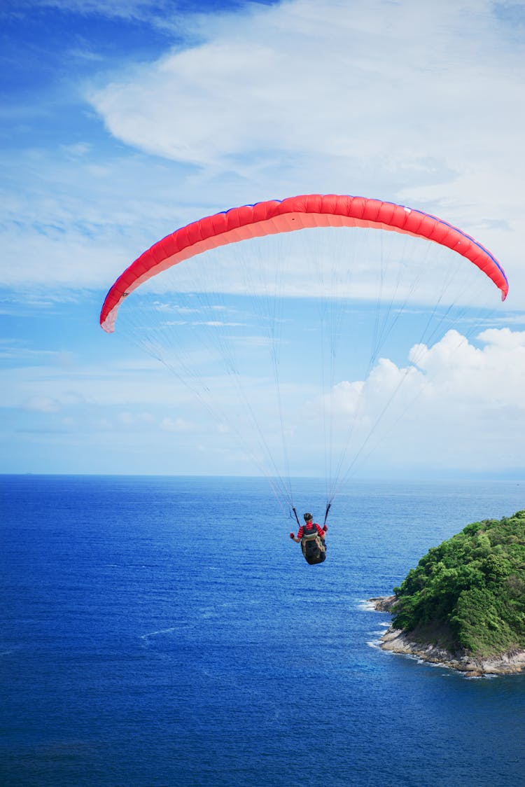 Photography Of Person Doing Parachute