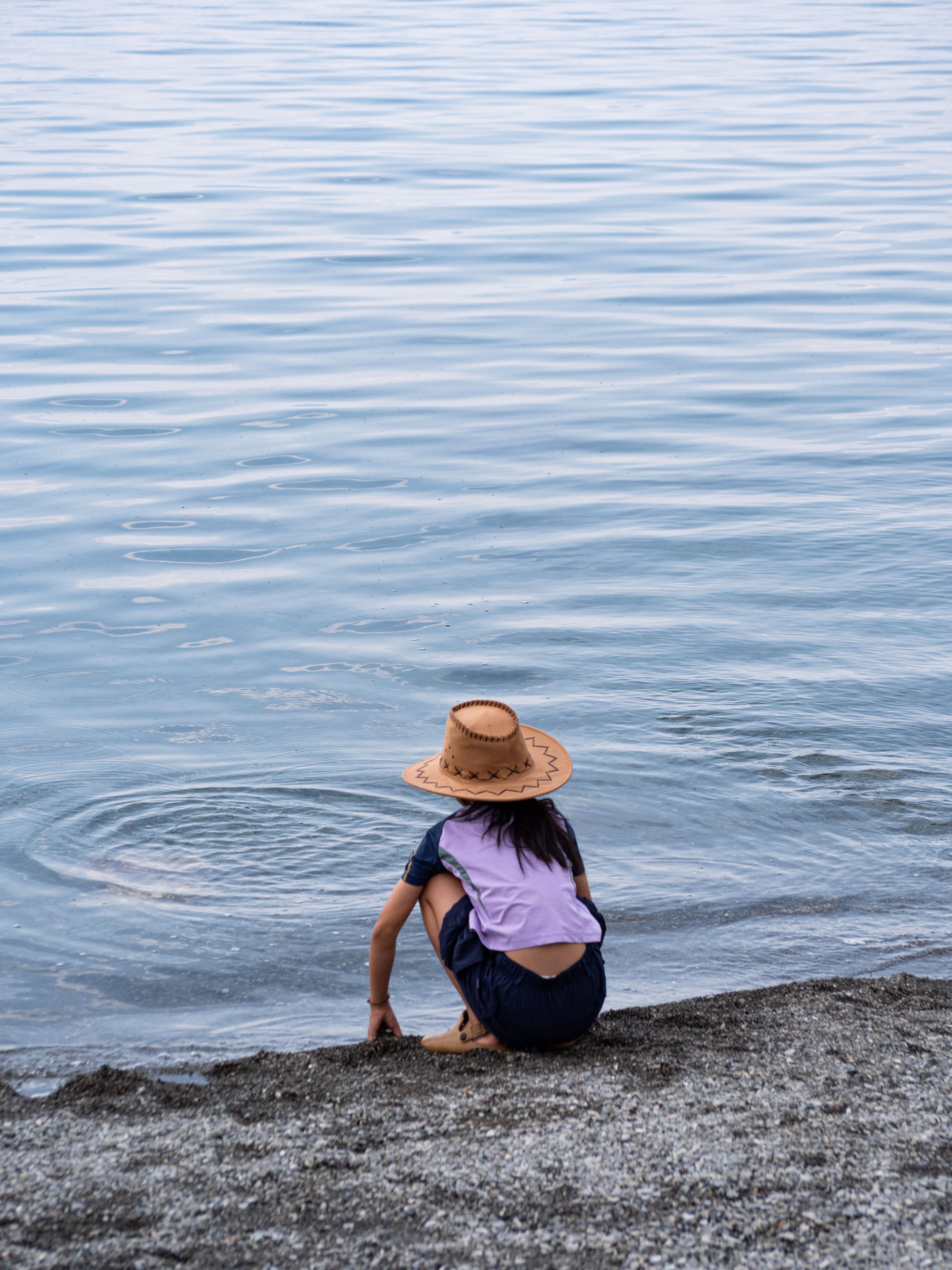 Child Playing by Serene Lakeside · Free Stock Photo