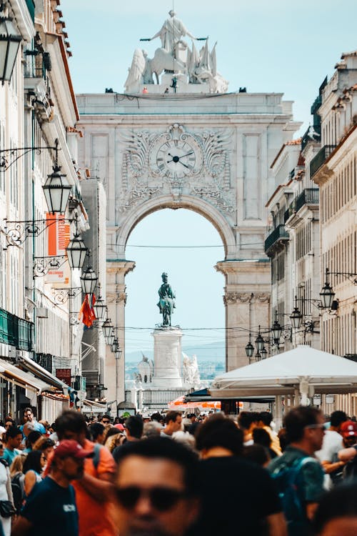 People Walking Beside Buildings