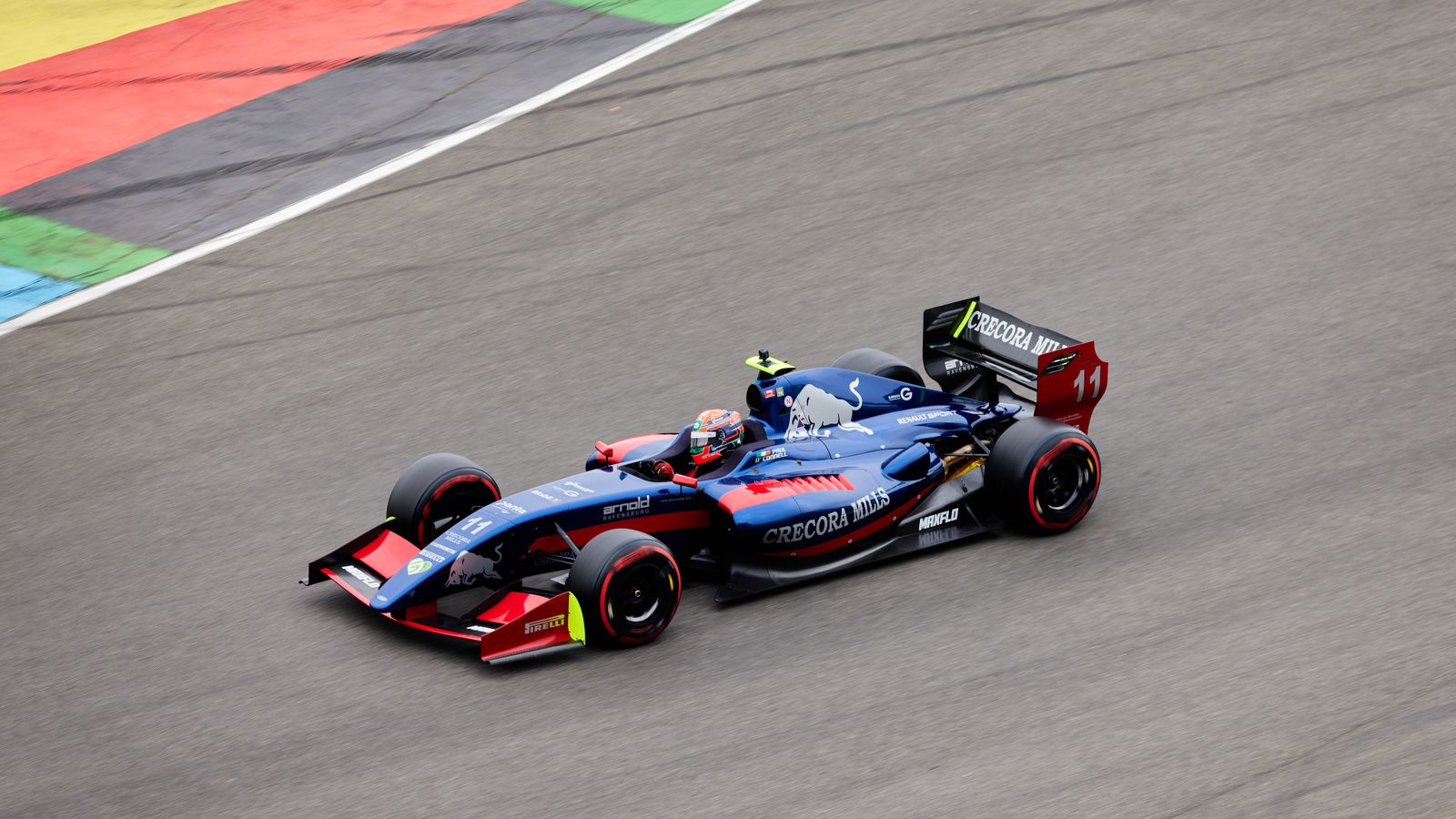 A blue race car speeding along a track with colorful markings, an illustrative real photo for the racing in Star Wars: Galactic Racer