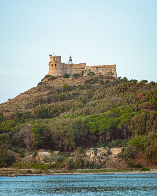 Free Explore the historic Tabarka Castle nestled on a hill in Tunisia surrounded by nature. Stock Photo