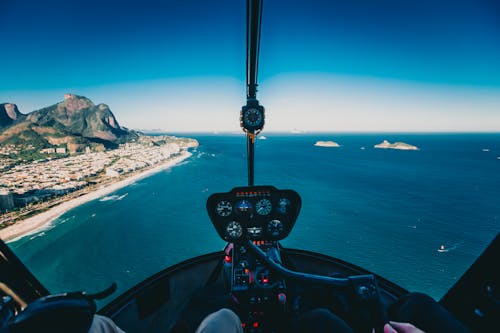 Free Photo of Person Flying a Helicopter Stock Photo