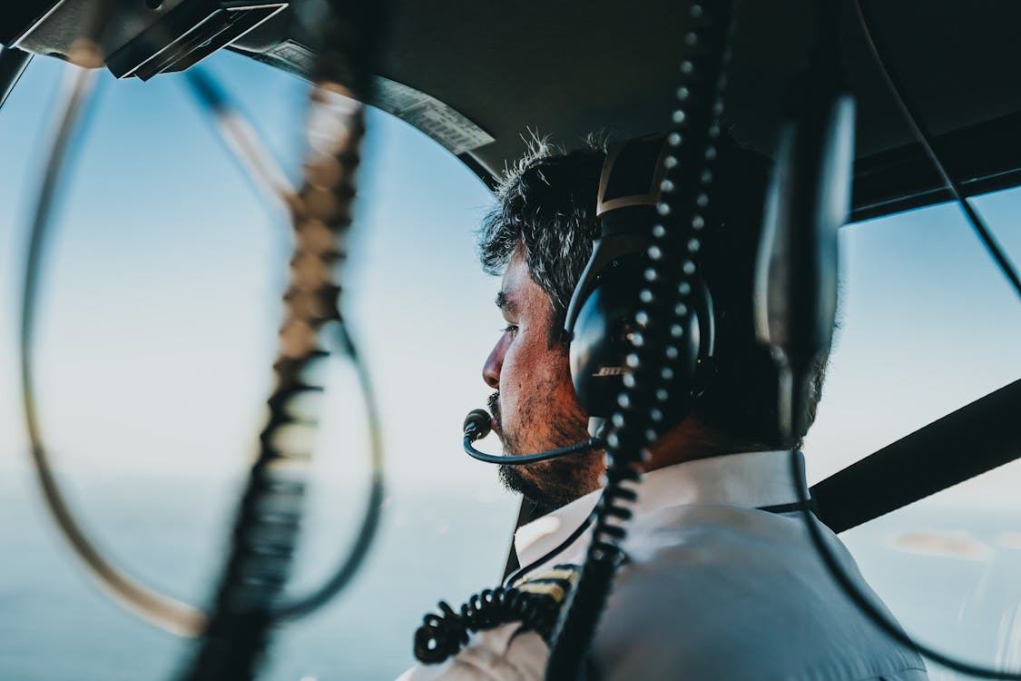 Free Photo of Man Flying a Helicopter Stock Photo