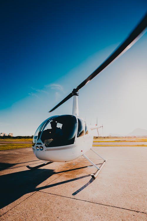Free Person Riding White Helicopter Stock Photo