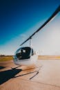 Person Riding White Helicopter