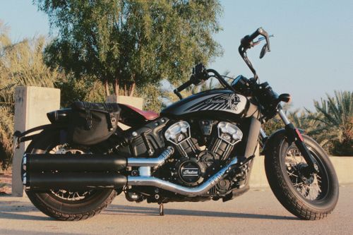 Free A sleek Indian motorcycle parked outdoors under a clear blue sky. Stock Photo
