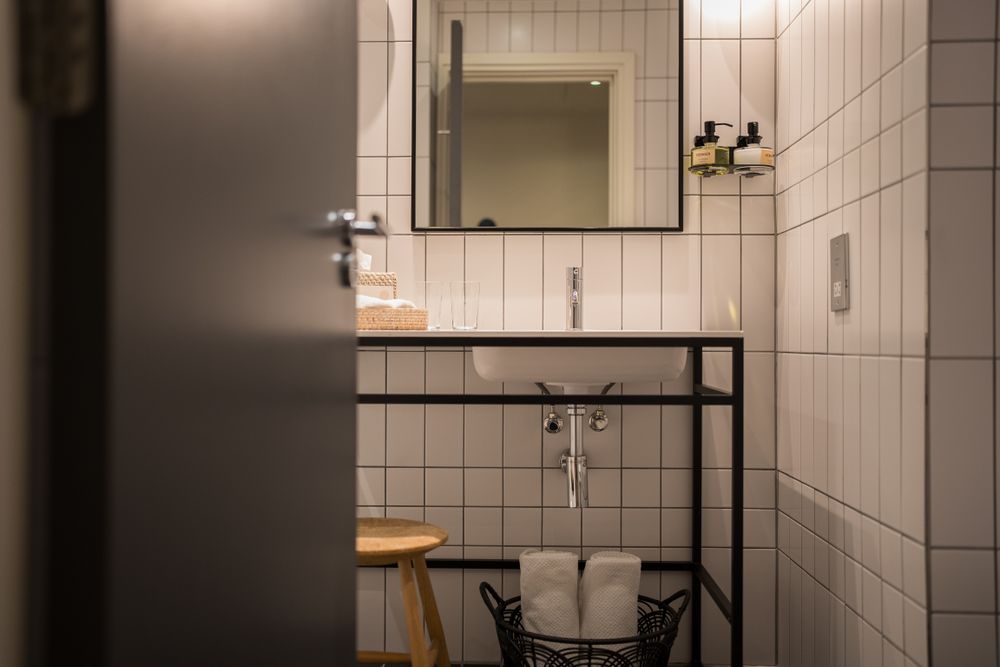 Modern bathroom with tiled walls