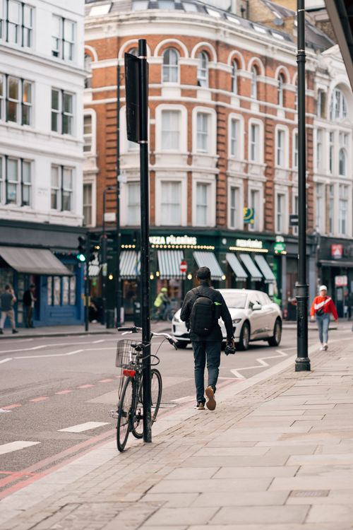 Free Urban street scene in London featuring pedestrians and classic architecture. Stock Photo