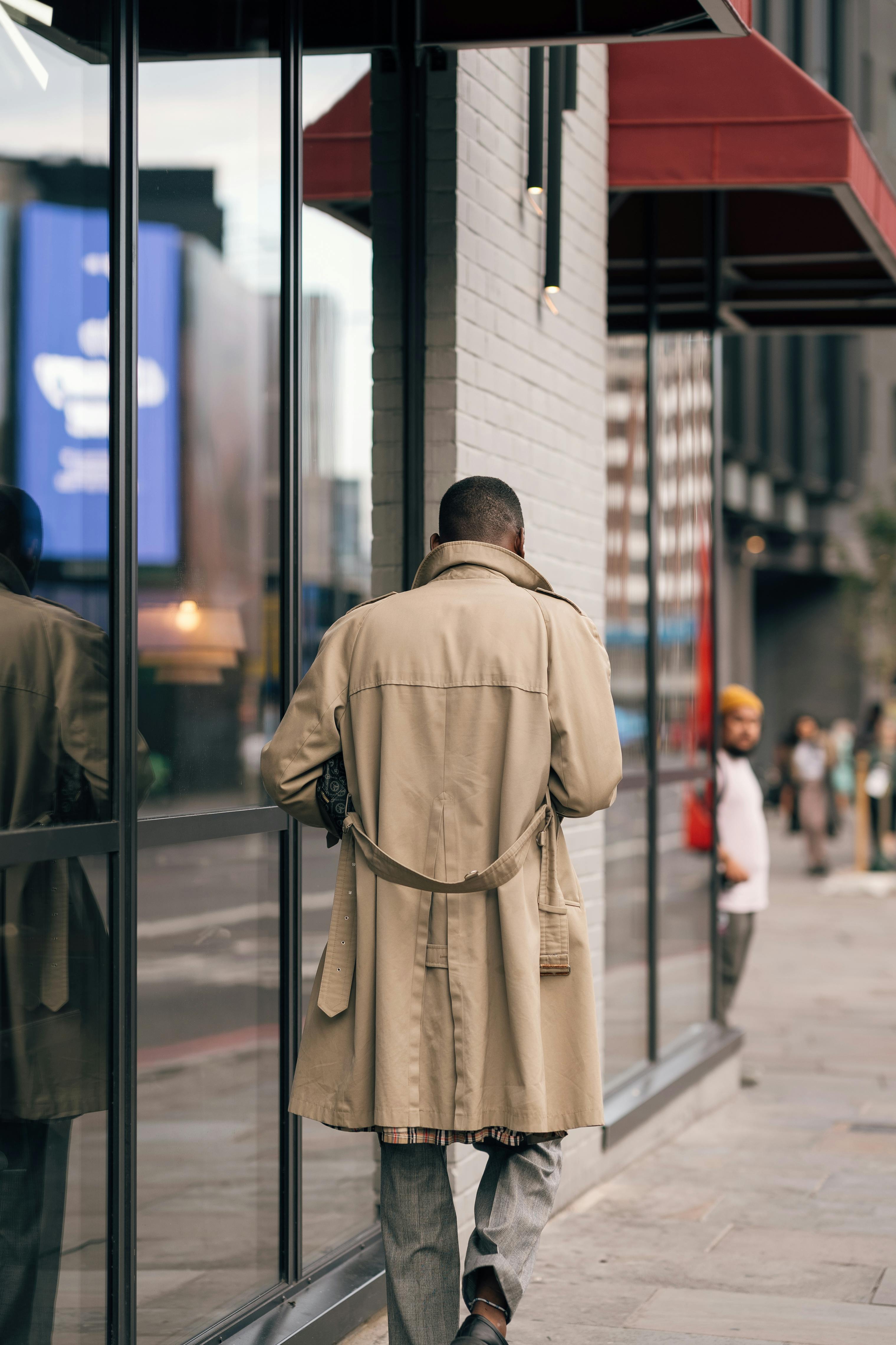 Man walking on London street in classic trench coat