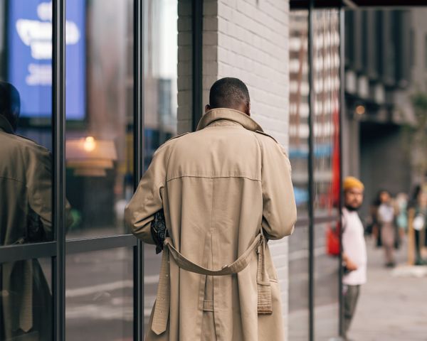 Man walking on London street in classic trench coat