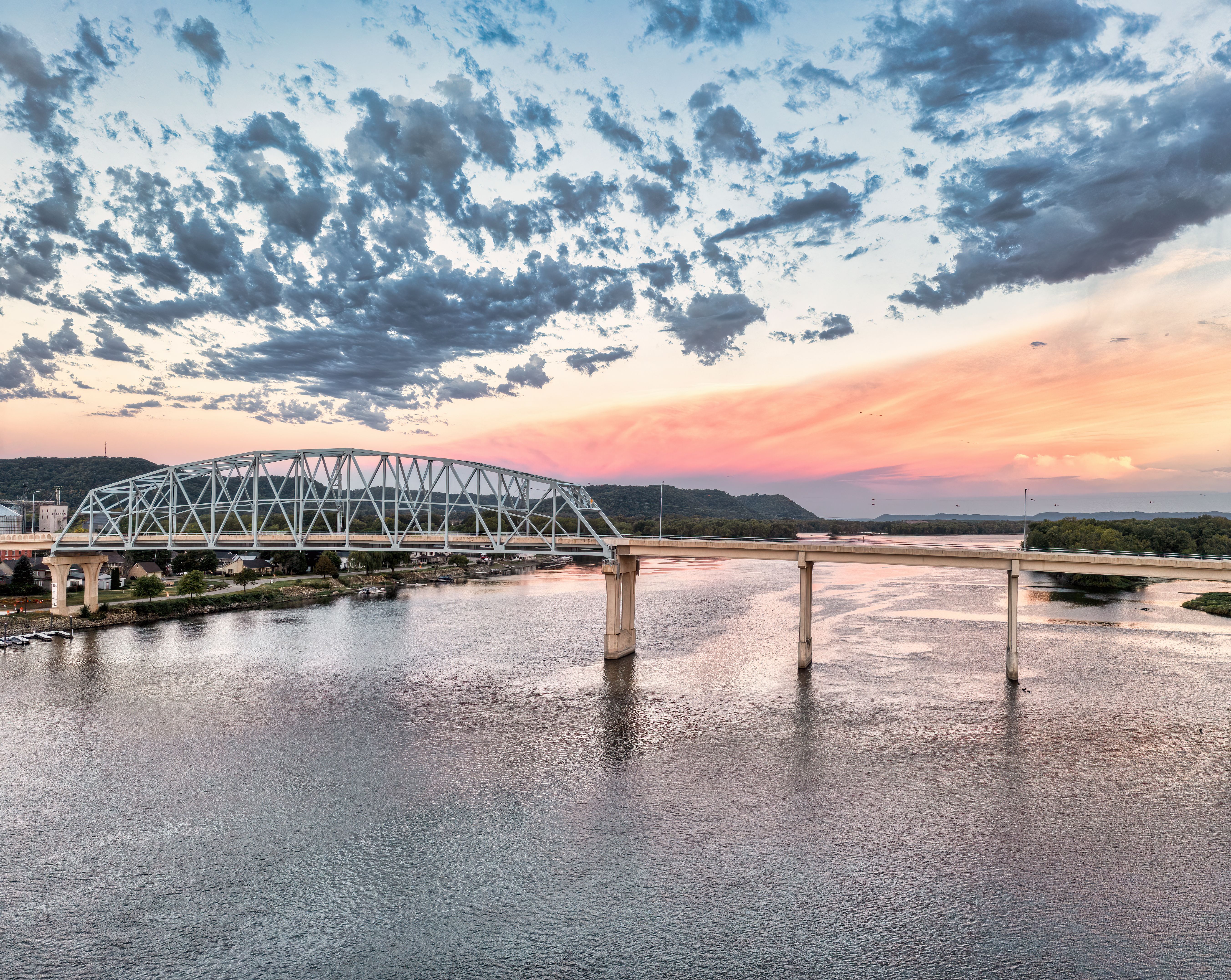Scenic sunset over the Mississippi River with a bridge in Wabasha, MN.
