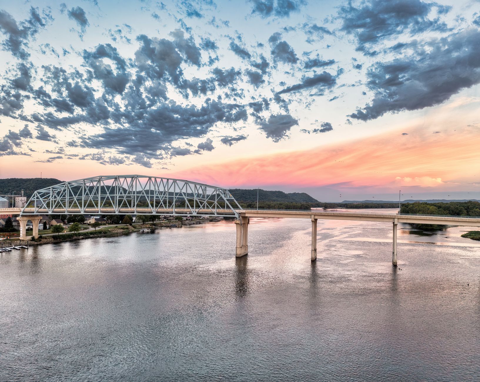 Scenic sunset over the Mississippi River with a bridge in Wabasha, MN.