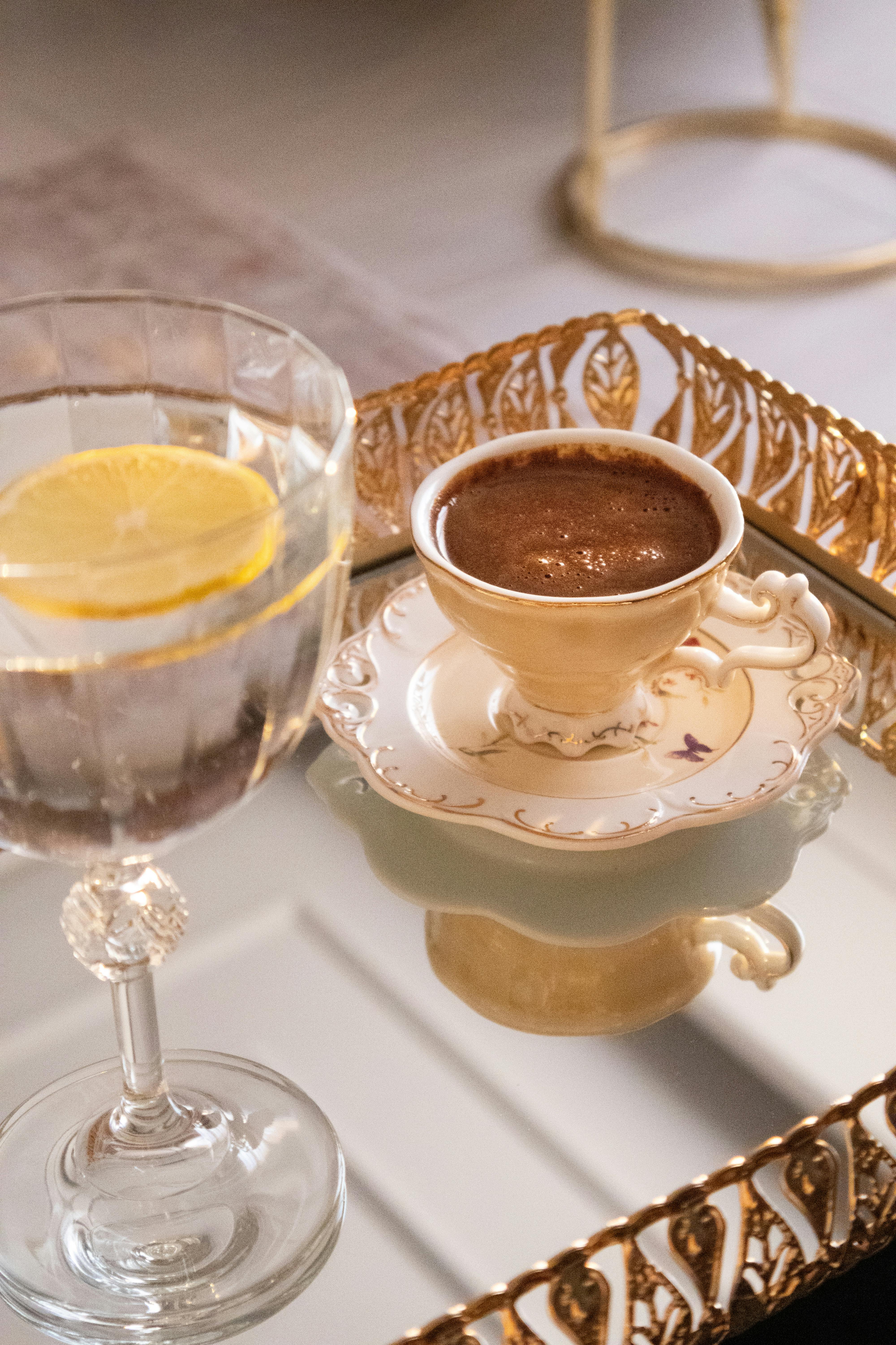 elegant coffee and lemon water on vintage tray