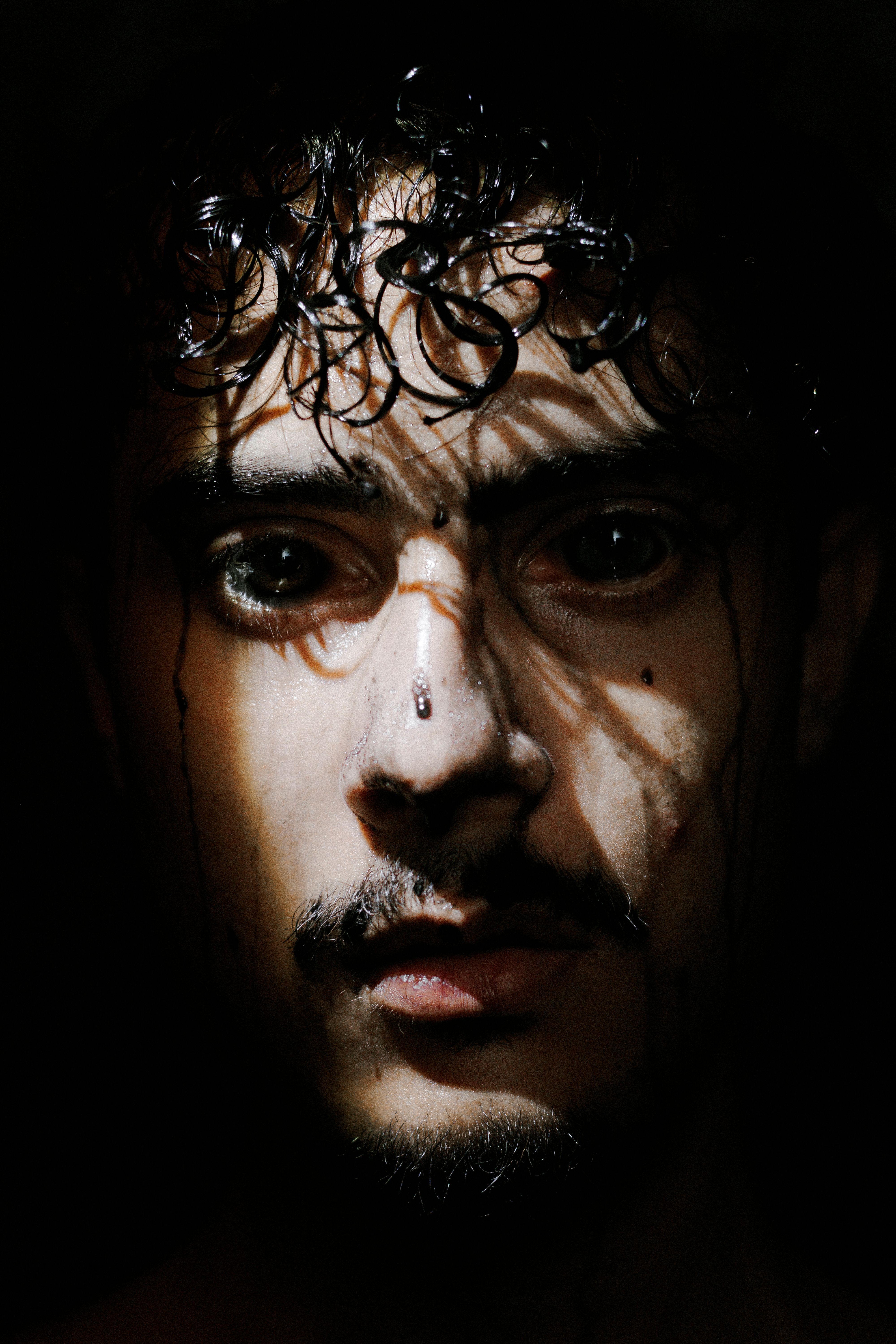Dramatic Portrait of Man with Shadow Effects · Free Stock Photo