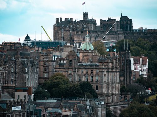 Breathtaking view of Edinburgh cityscape with Edinburgh Castle in the background.