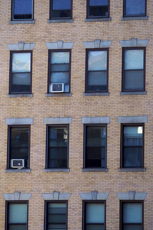 Free Close-up view of a historic brick building facade in Boston with symmetrical windows. Stock Photo