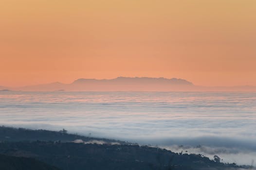 Beautiful sunrise over clouds in Santa Barbara, creating a serene and warm atmosphere.