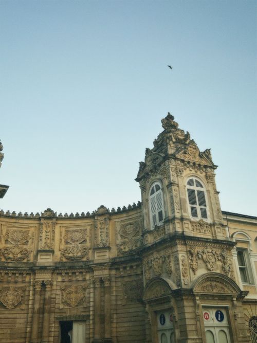 Free Ornate historical building with intricate details against a clear blue sky. Architectural wonder. Stock Photo