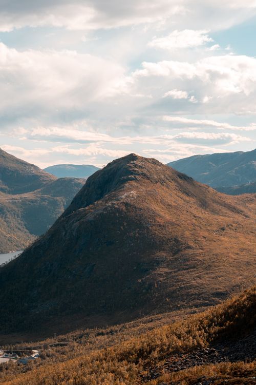 Free Breathtaking view of mountain peaks in Tromsø, Norway under a bright sky. Stock Photo
