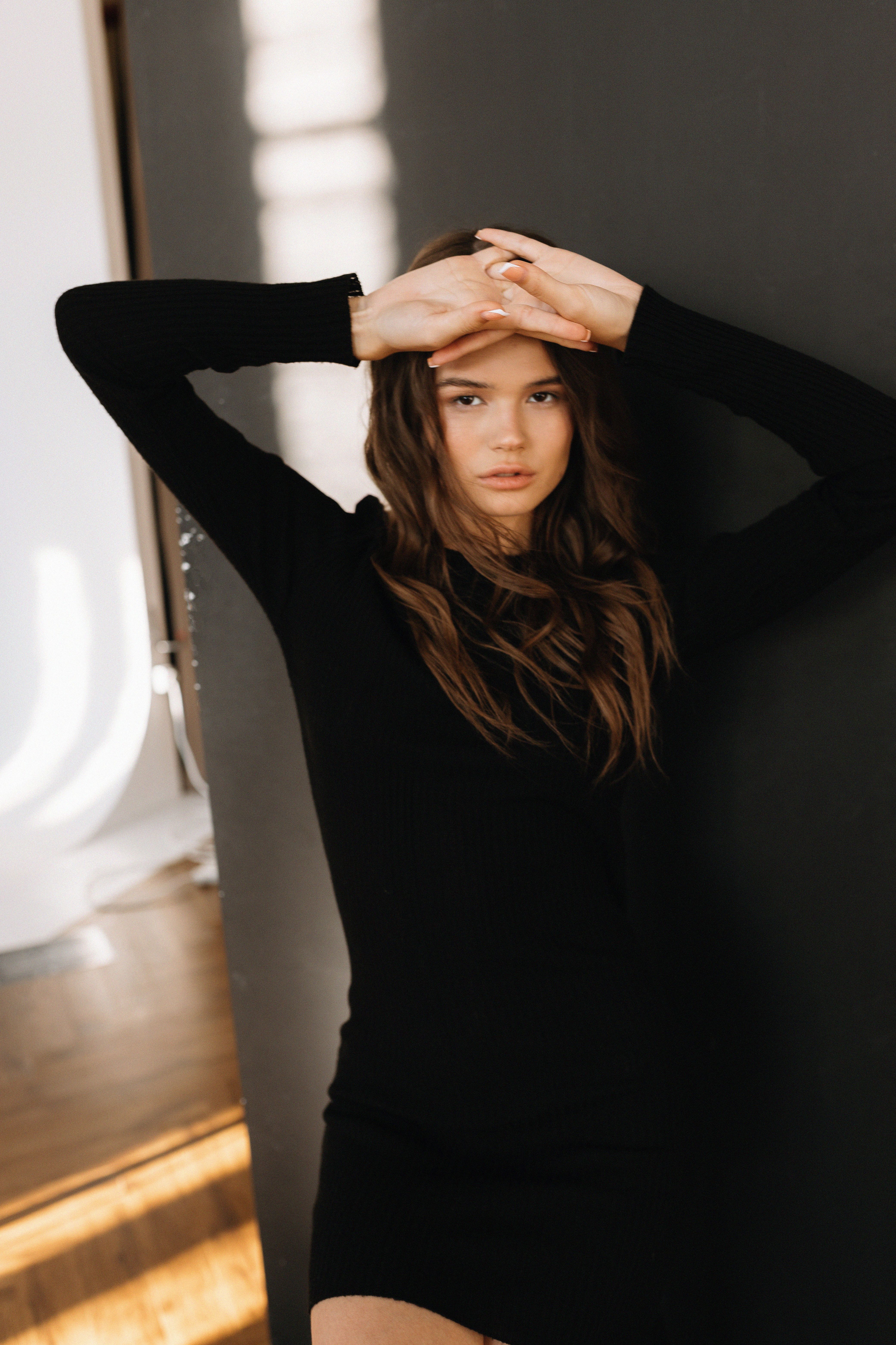 Stylish Woman in Black Dress Indoors · Free Stock Photo