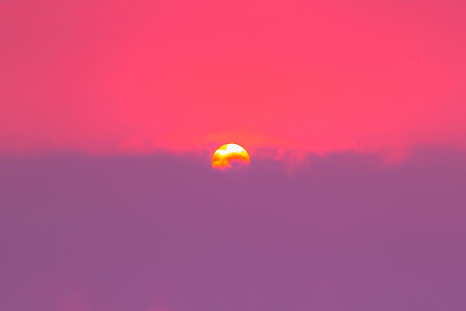 Stunning sunset with pink and purple hues over Ho Chi Minh City, perfect for nature and travel enthusiasts.