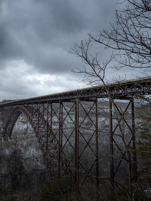 Free Dramatic winter view of the New River Gorge Bridge with stormy skies. Stock Photo