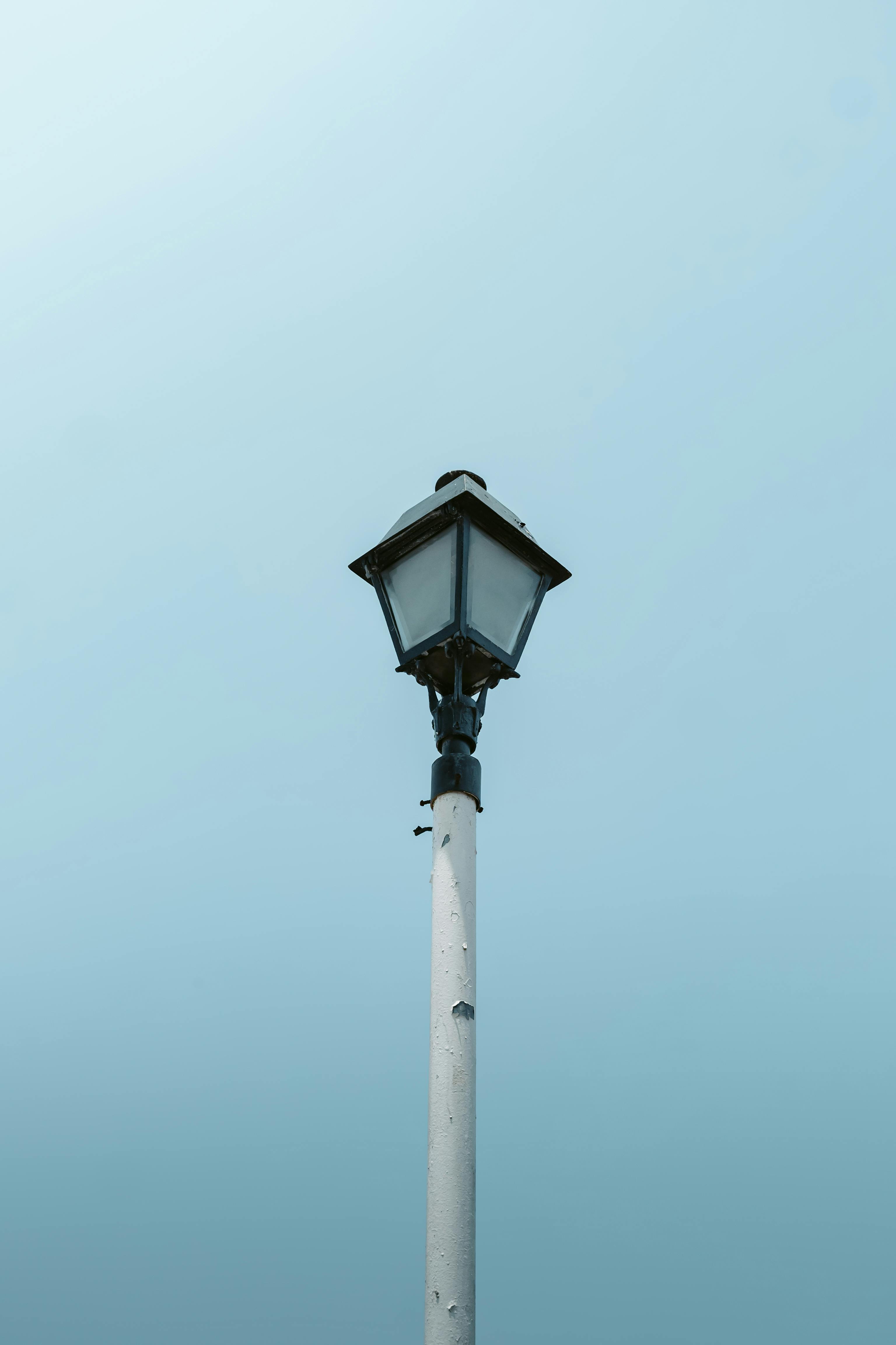 Free A classic street lamp set against a serene blue sky in Tlacotalpan, Mexico. Stock Photo