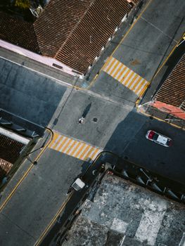 Aerial shot of a quiet street crossing in Tlacotalpan, Mexico, showcasing urban architecture and roads.