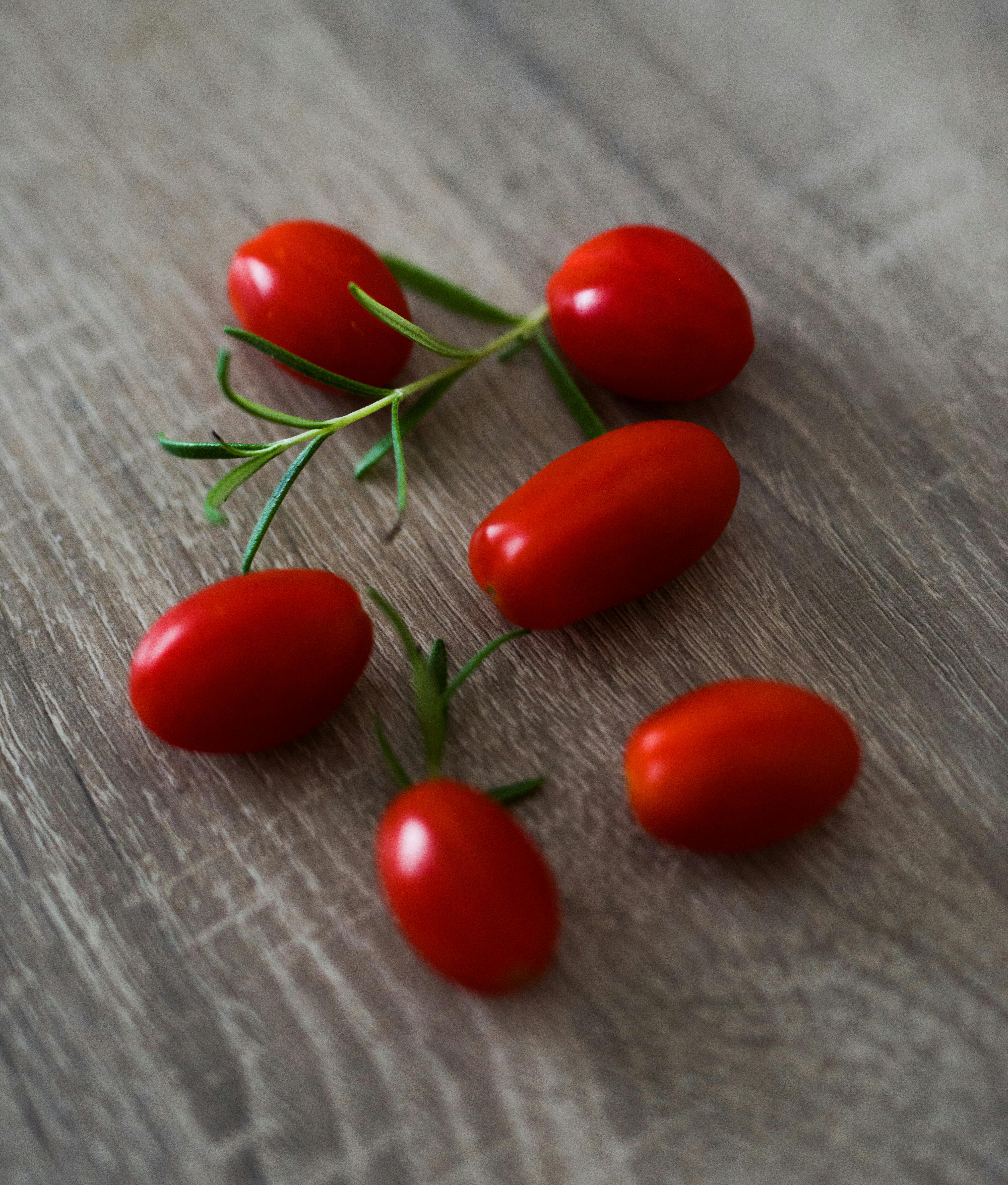 Six Red Goji  Berries on Brown Wooden Surface  Free Stock 