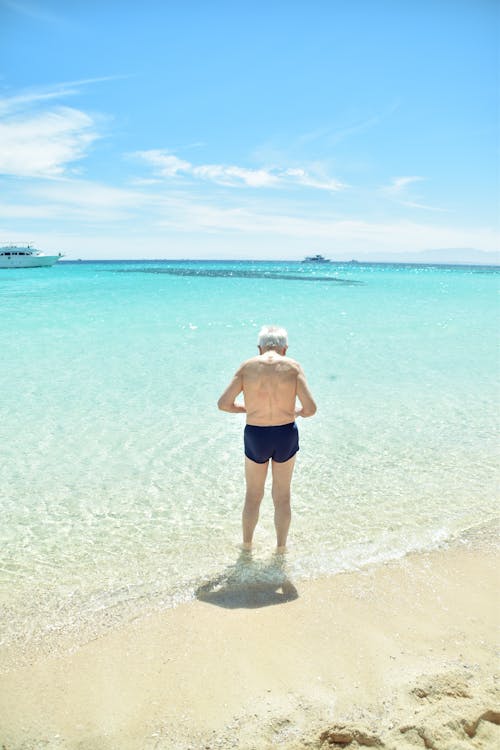 Back View of an Elderly Person on the Beach