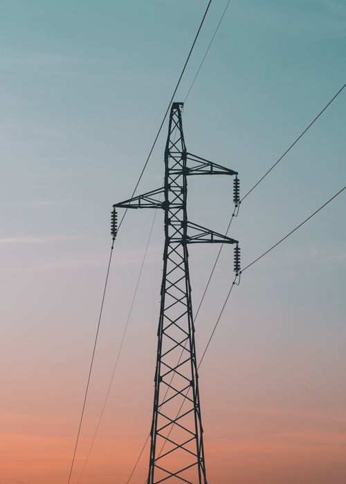 Free A silhouette of a high voltage pylon during sunset in Jendouba, Tunisia. Stock Photo